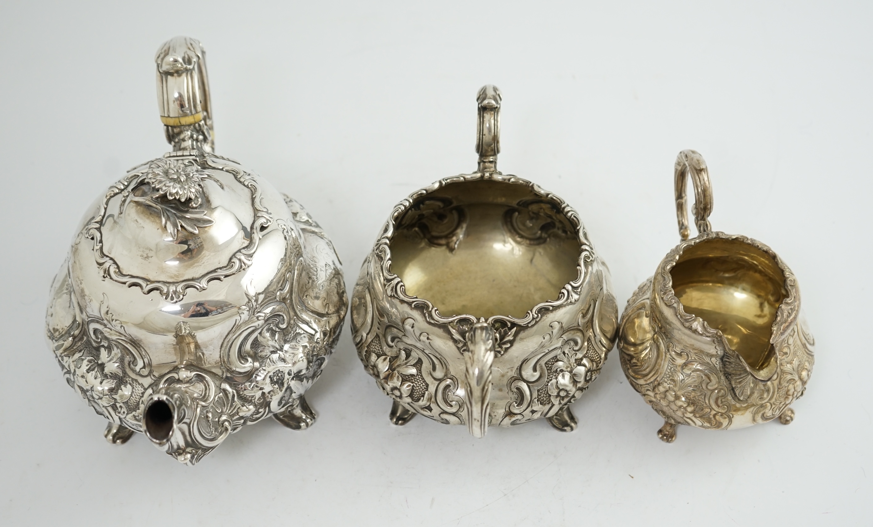 A matched Victorian and later silver three piece tea set